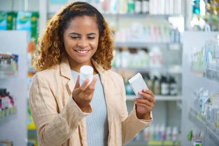 Woman looking at medication