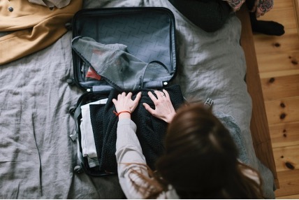 woman packing a suitcase