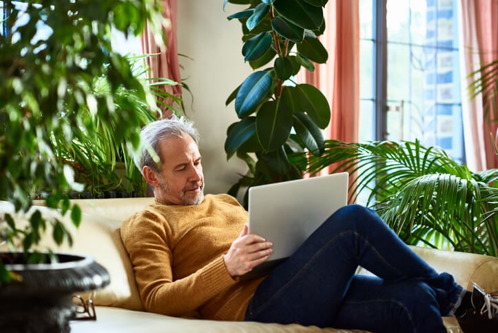 Man reading on laptop