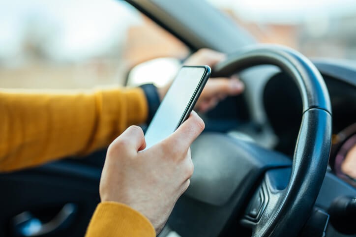 Person driving while on a cell phone