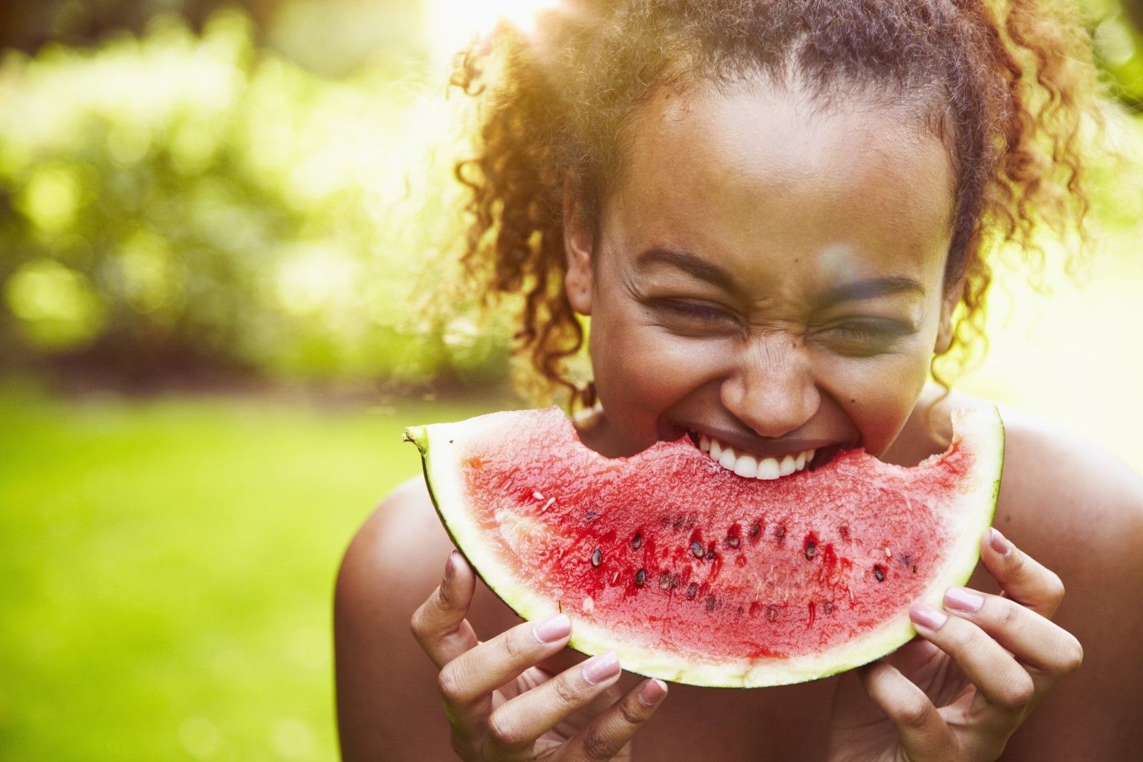 Woman eating watermelon