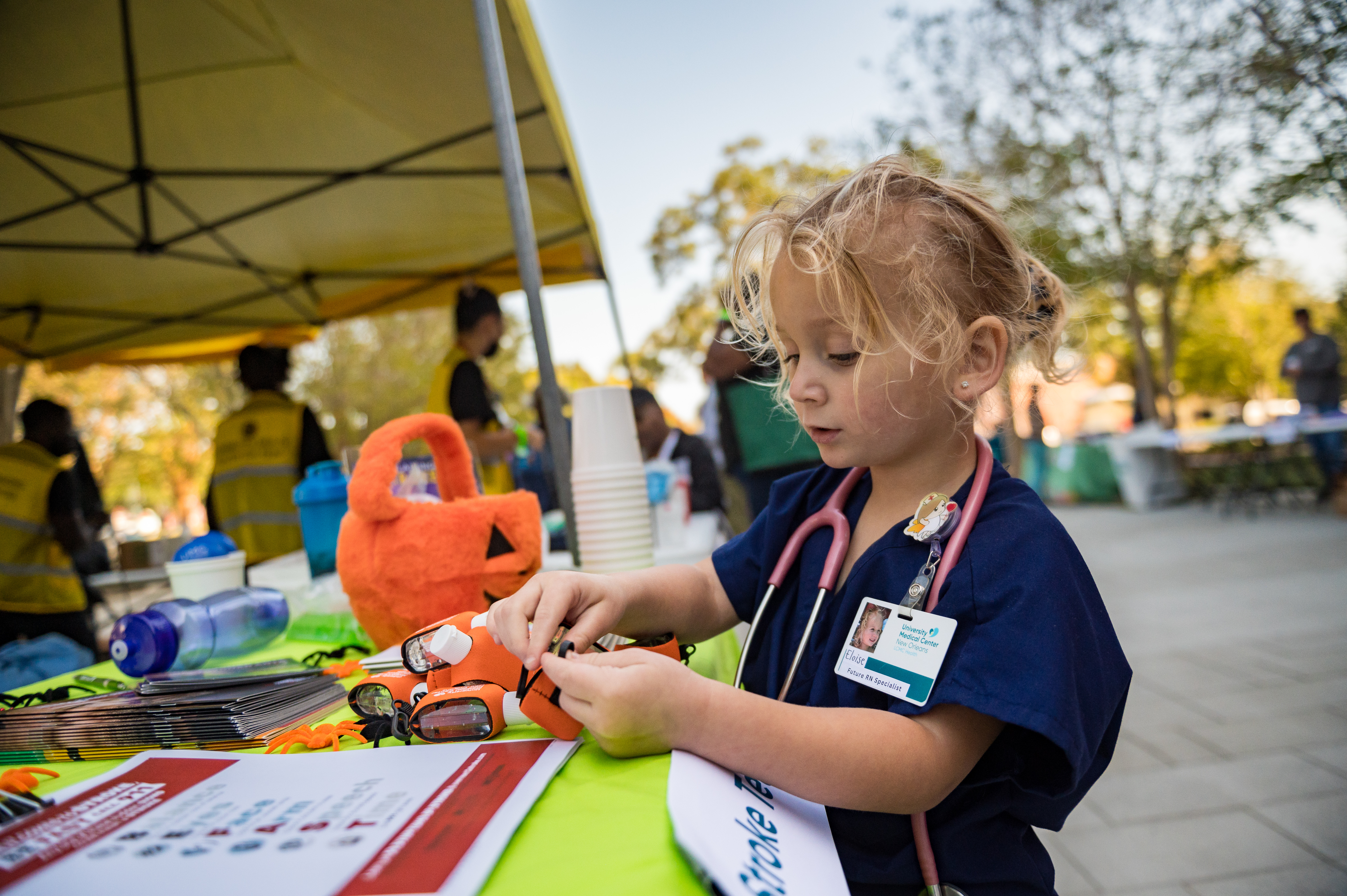 A young girl dressed as a nurse at the 2024 UMC community health fair