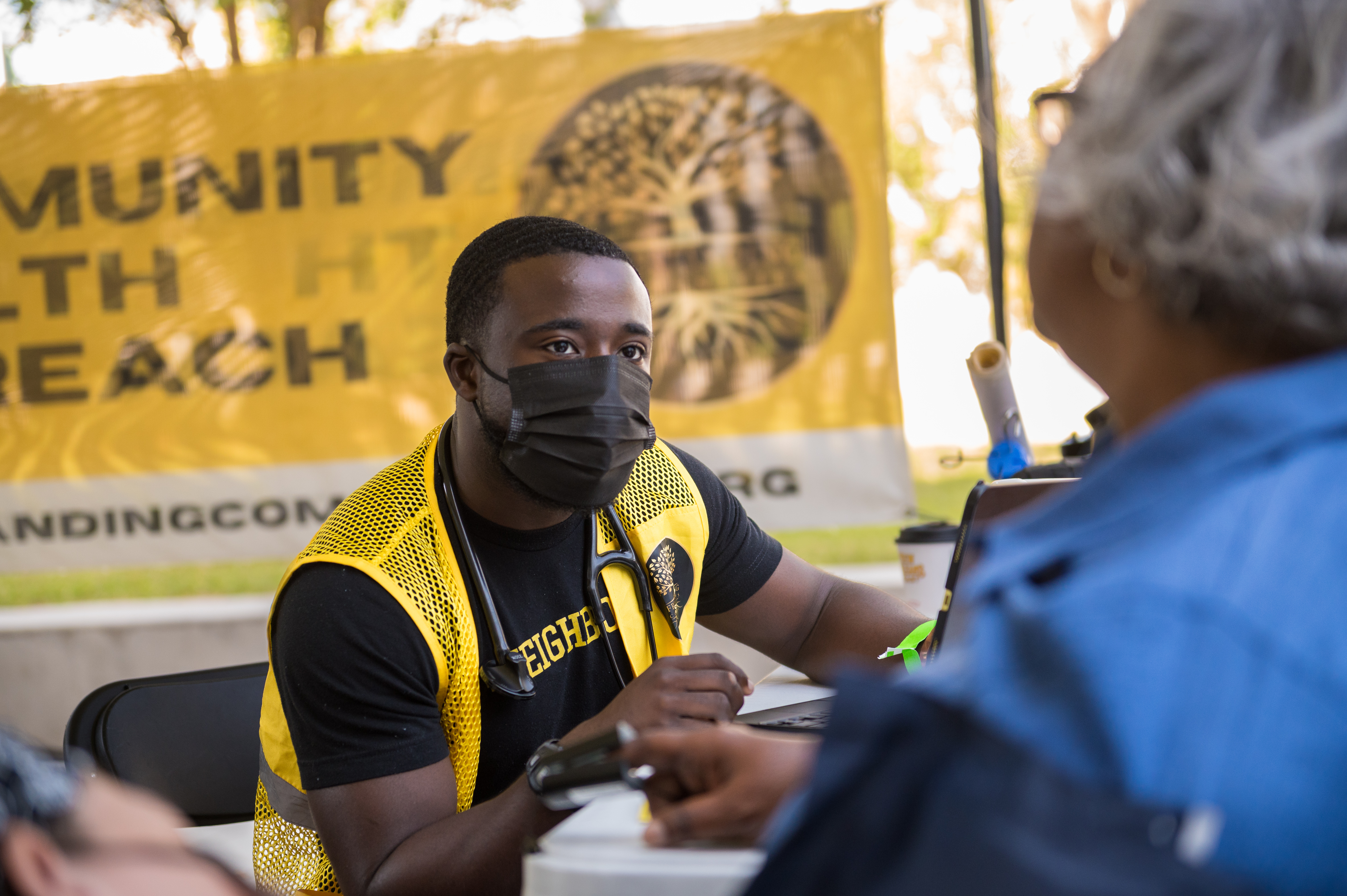 A community member receiving a vaccination at a UMC health fair