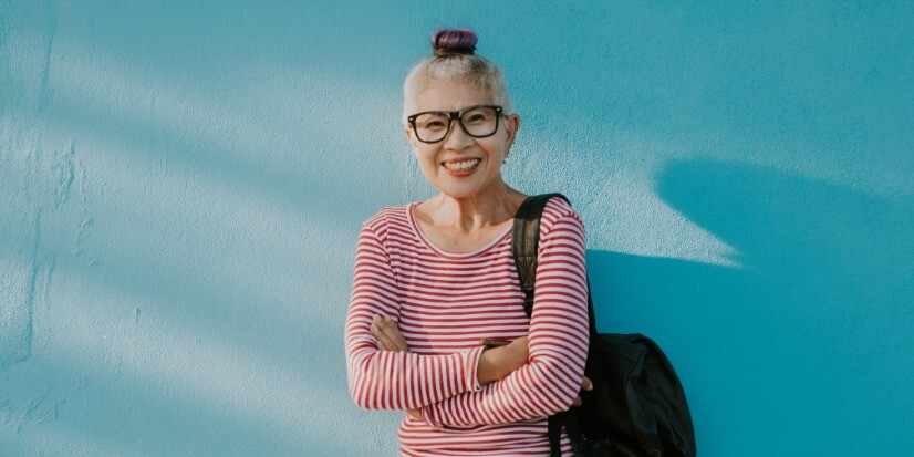 woman against a colorful wall