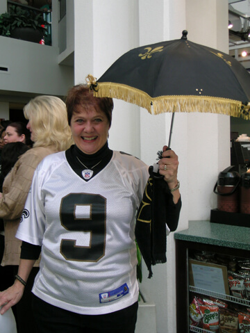 woman holding saints umbrella
