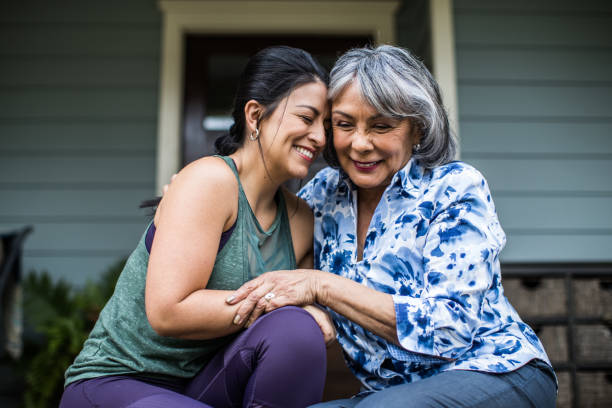 Two woman holding each other