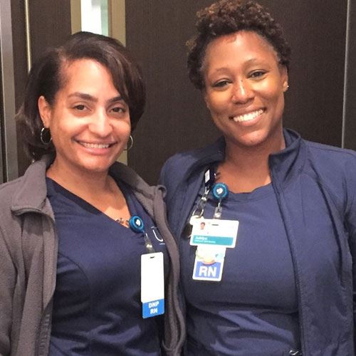 two nurses smiling