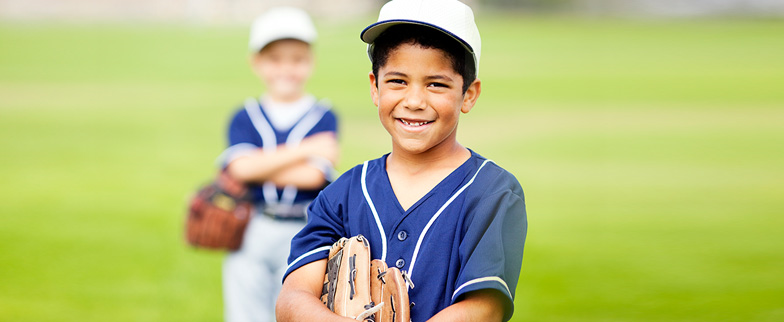 Child ready to play baseball.
