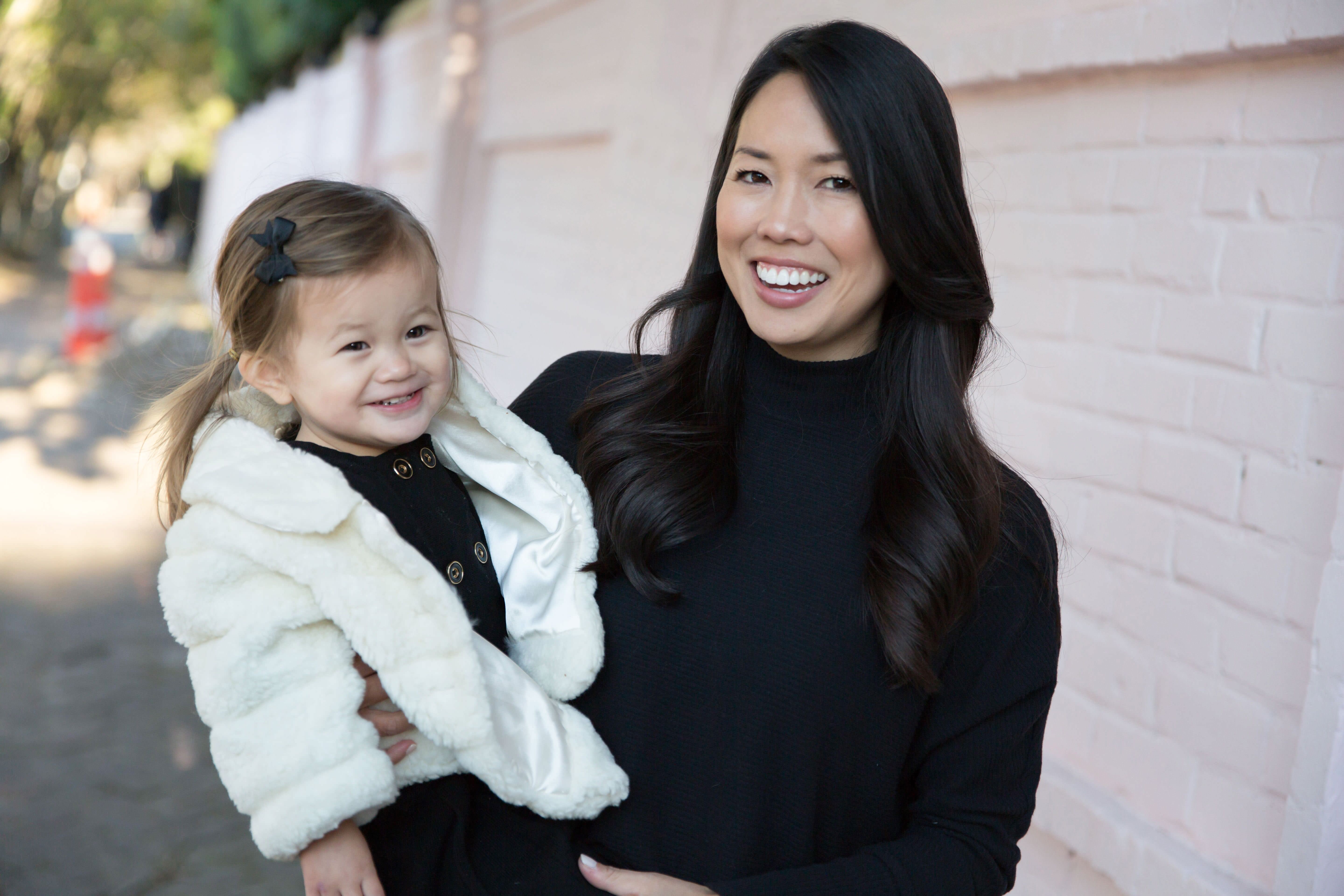 mother and daughter smiling