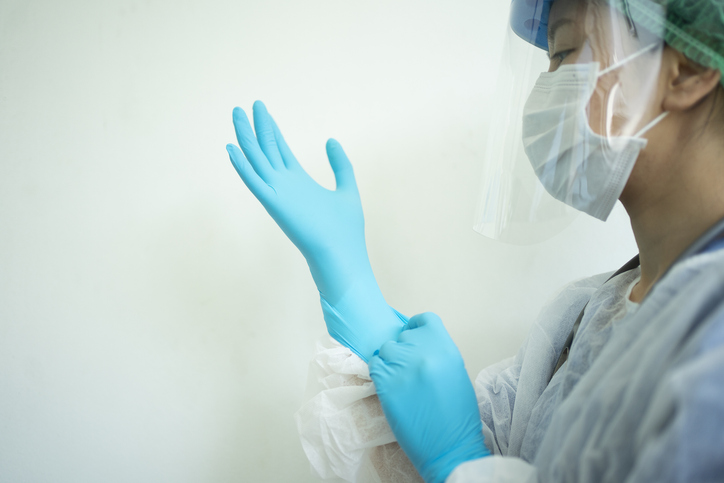 woman wearing personal protective equipment