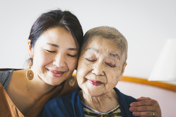 daughter hugging mother diagnosed with cancer