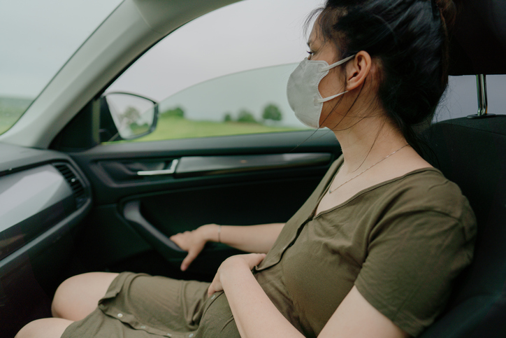 Woman looking outside the car