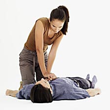 Woman giving CPR to the man