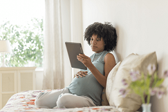 pregnant woman using an iPad