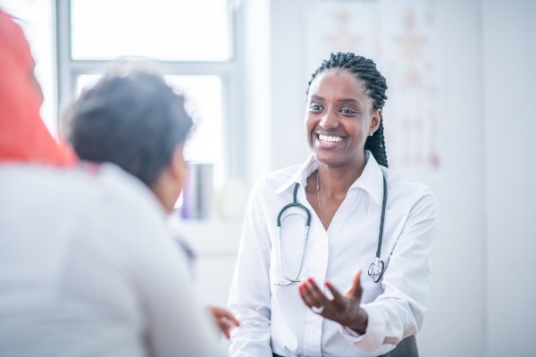 Female doctor talking to patient