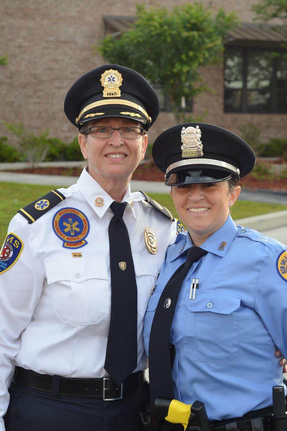 Two police staff smiling