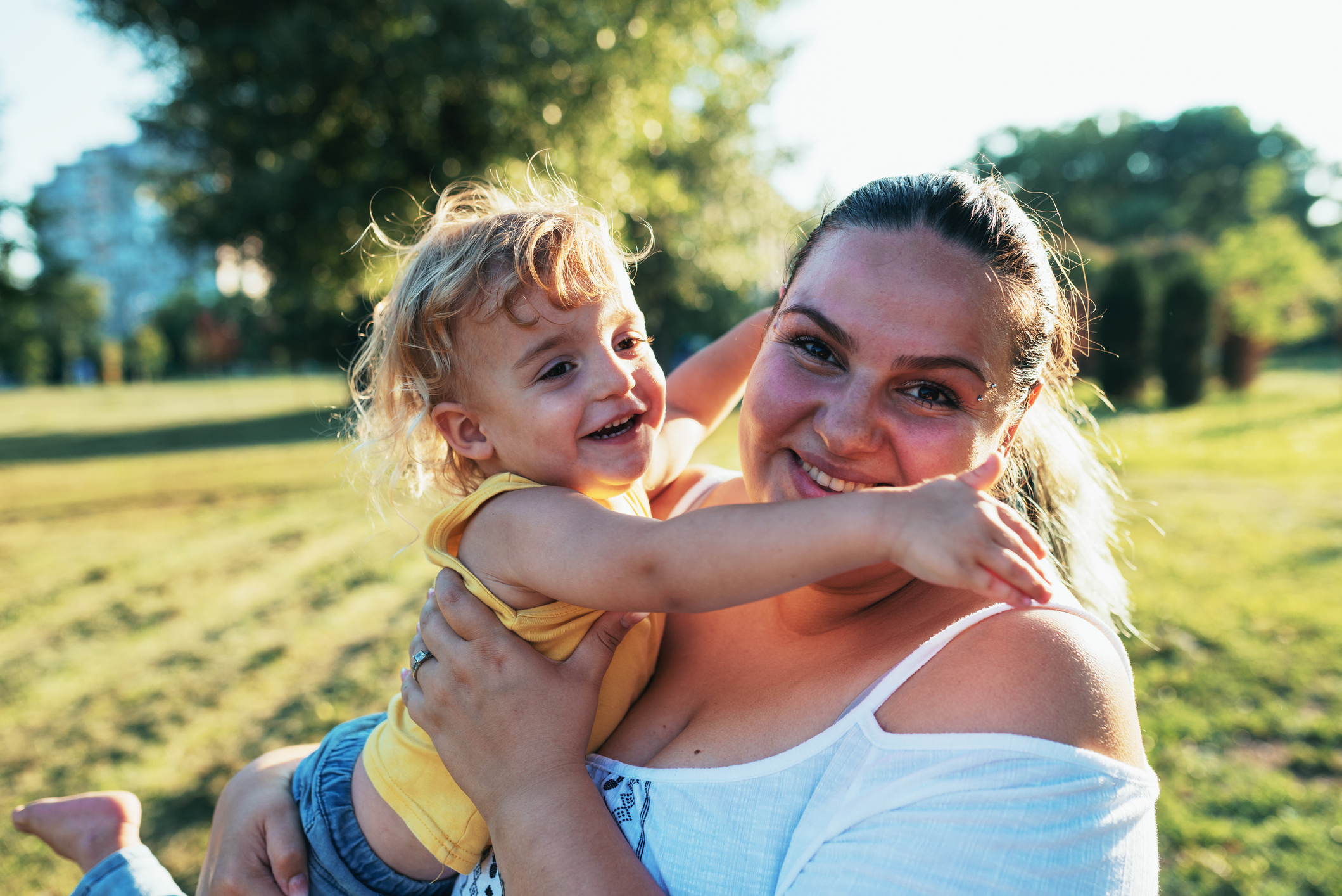 Happy woman hugging her child