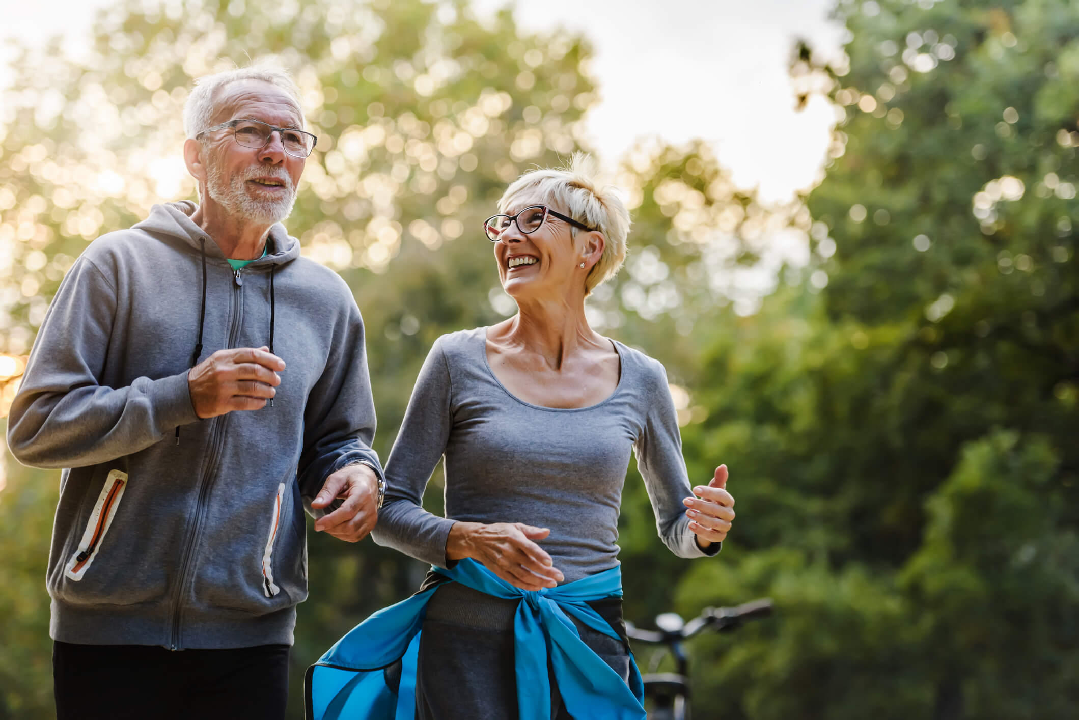 Elderly man and woman jogging