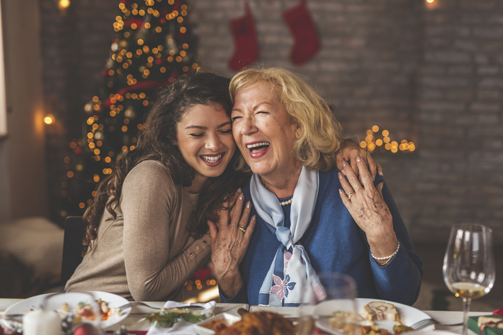 girl and her mom smiling and hugging