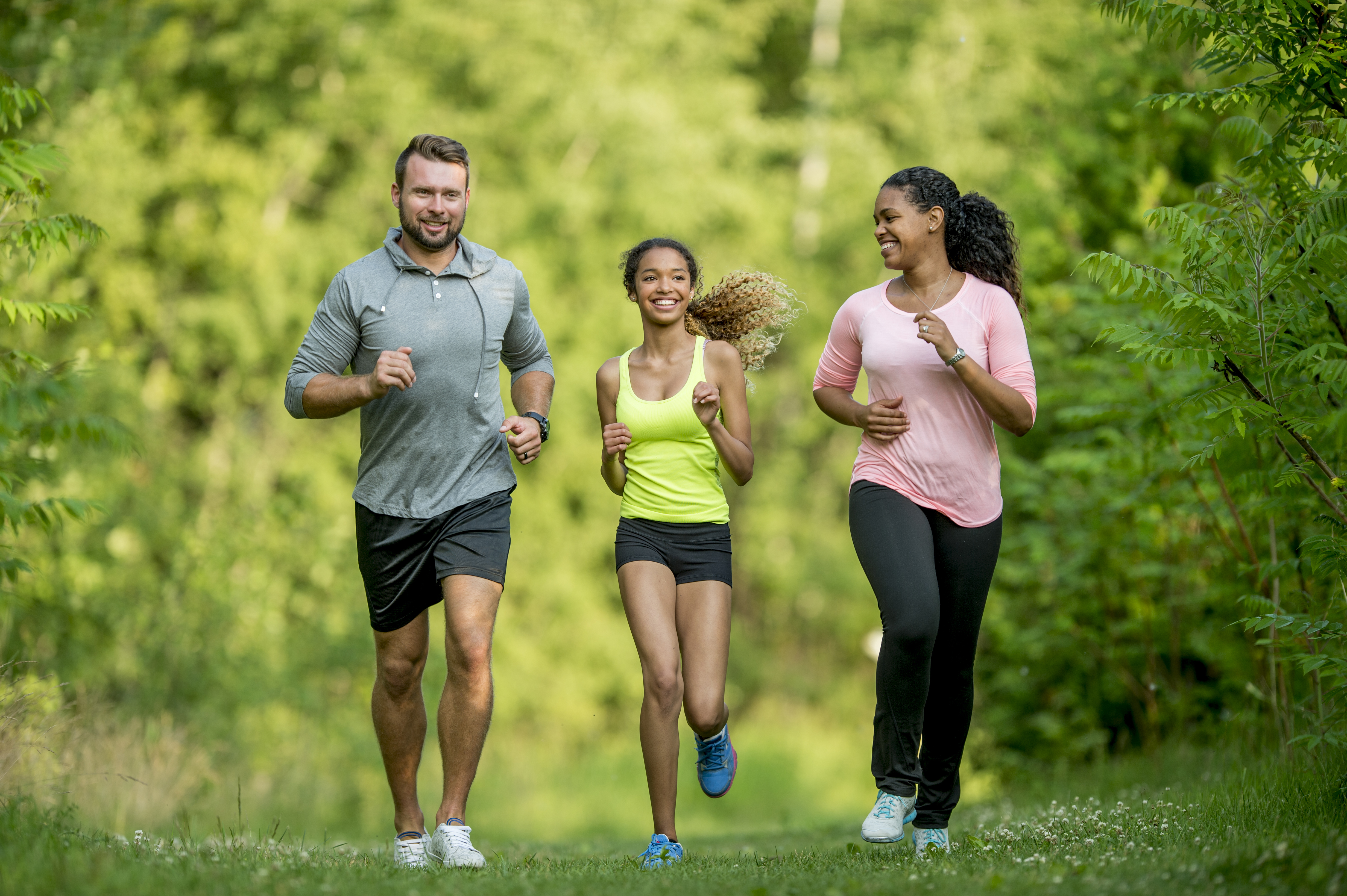 Three people jogging