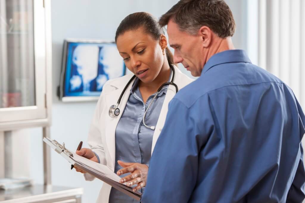 Man and Lady Doctor looking at a document