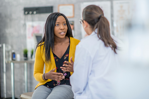 Lady speaking to a doctor