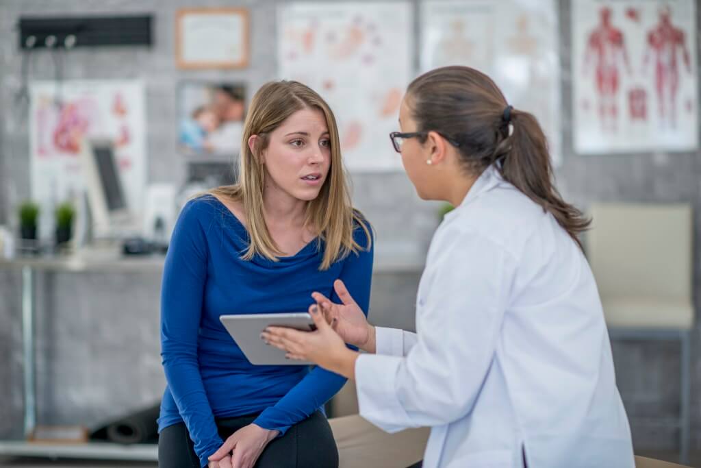 Lady talking to a doctor