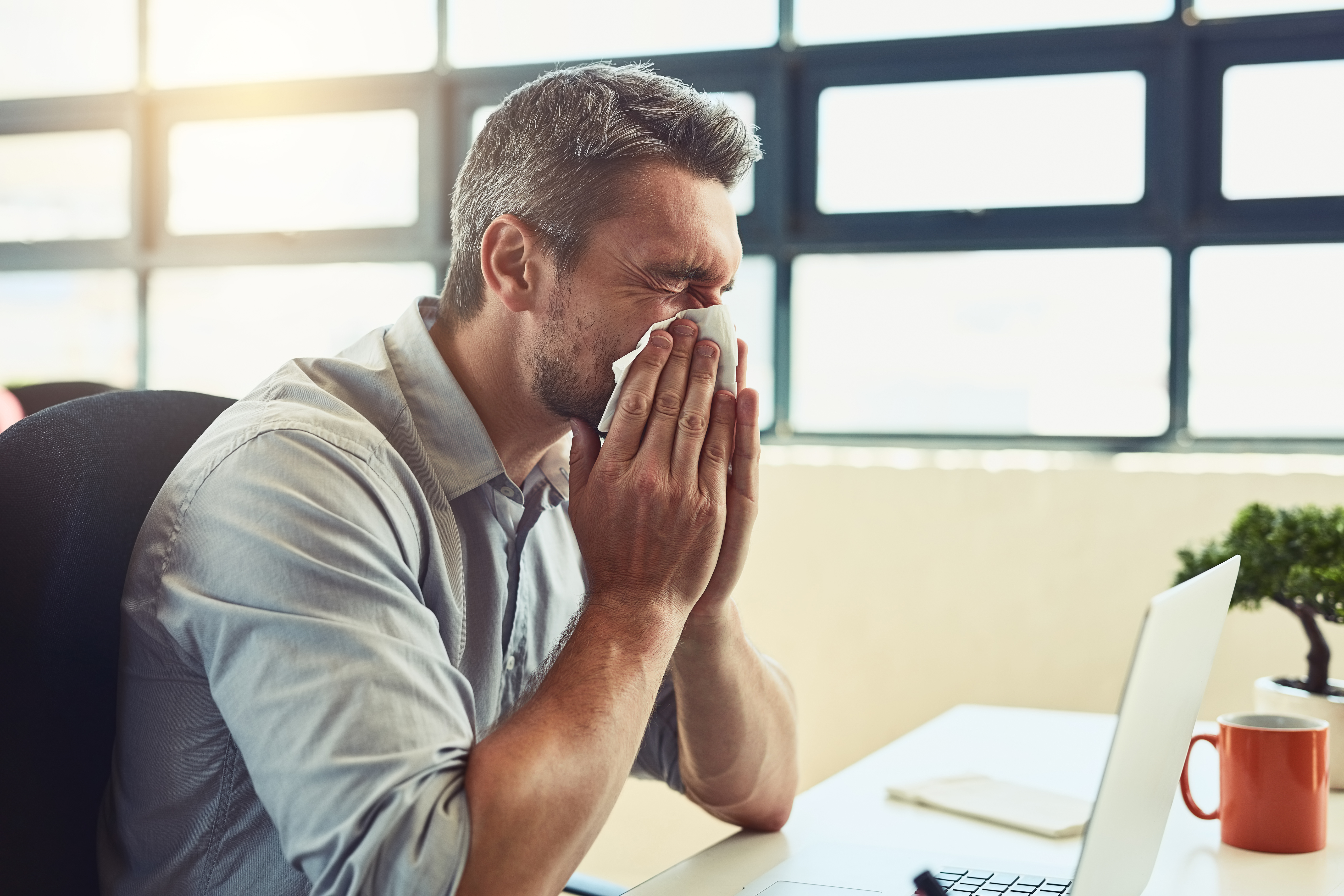 Man blowing his nose