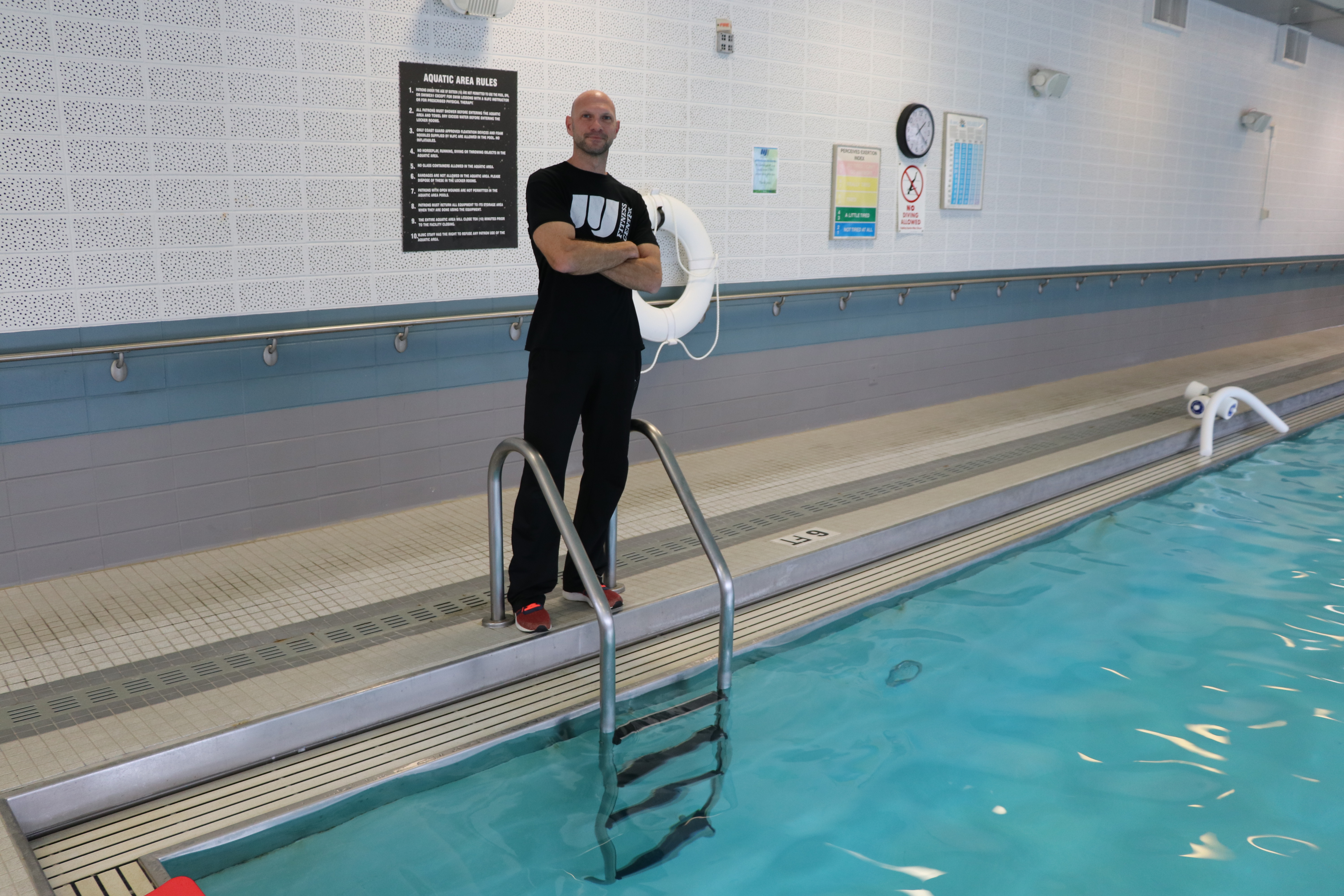 man beside a pool