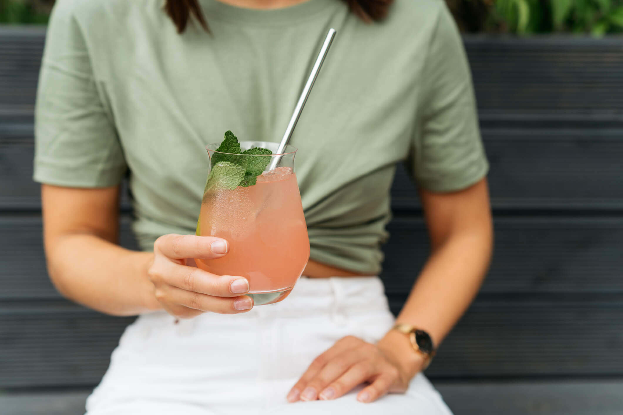 woman holding a fancy beverage