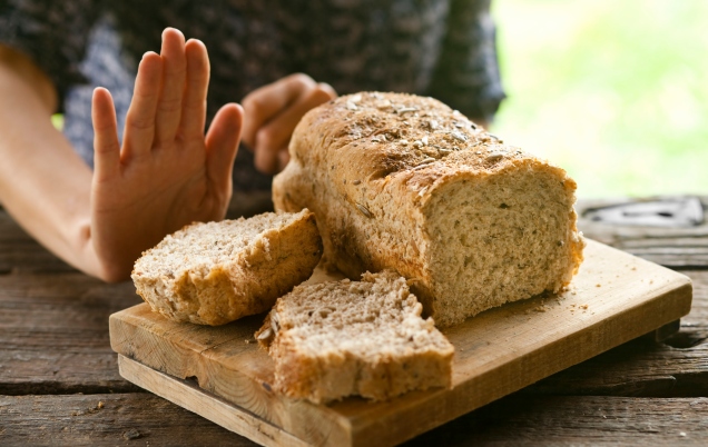 A person turning down bread