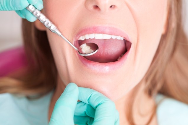 woman getting dental exam