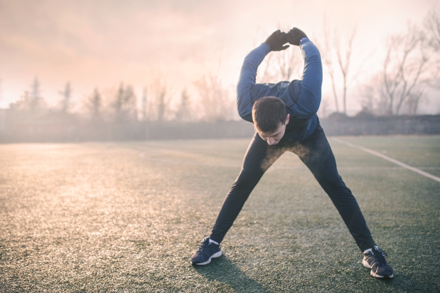 Man stretching back outside