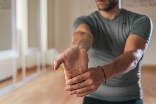 man stretching wrists