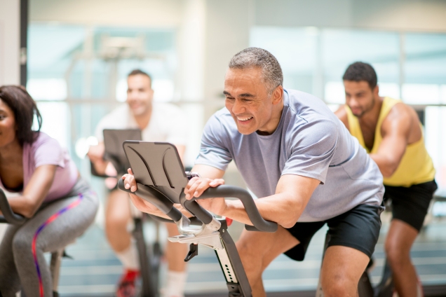 Adults in a Cycle group exercise class