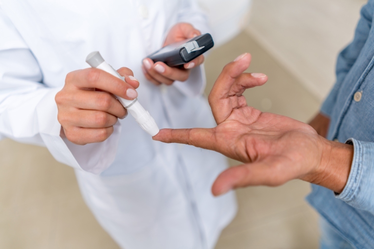 patient having blood sugar levels measured