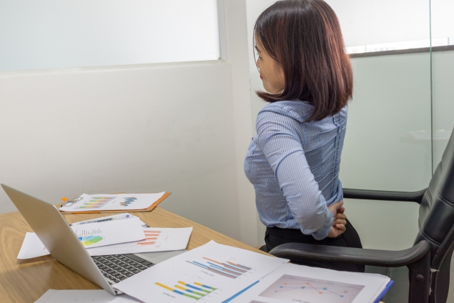 Woman Stretching at her desk