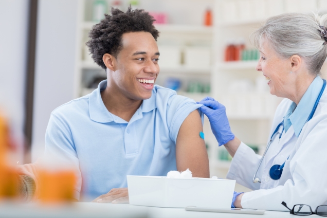 Older woman administering vaccine