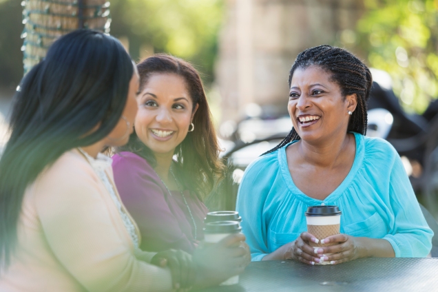 Three women having coffee, talking