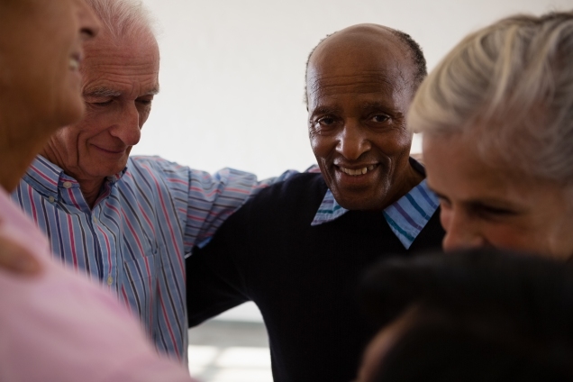 Group of older men in a circle