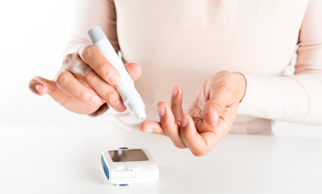 person checking blood glucose level