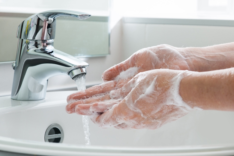 person washing hands