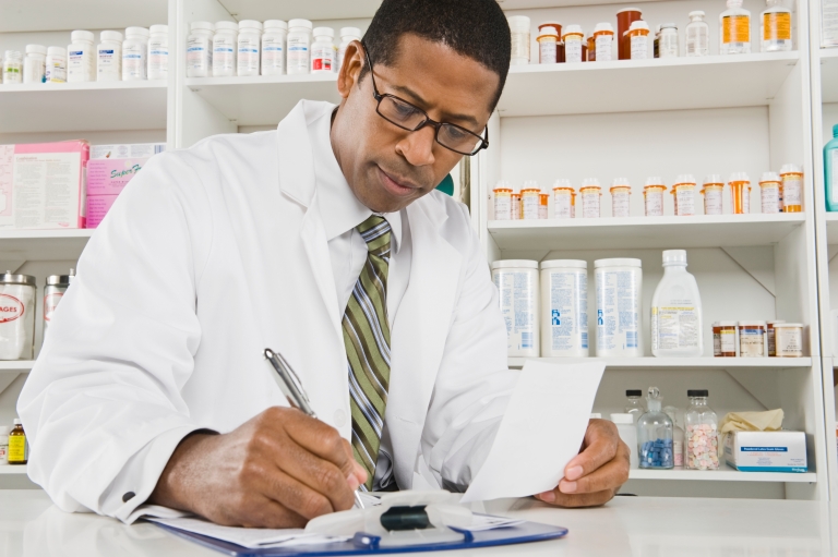 pharmacists writing prescription