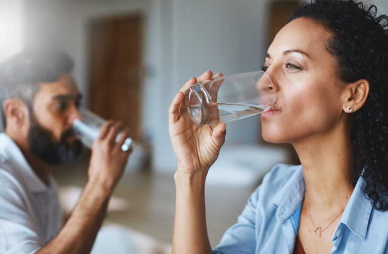 Man and woman drinking water