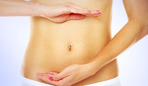 woman with her hands on stomach