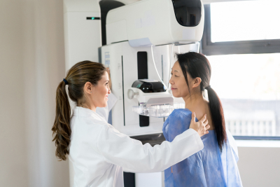 woman receiving mammogram