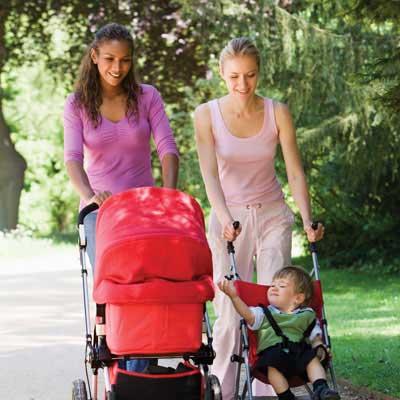 women pushing strollers