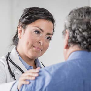 Doctor speaking with patient